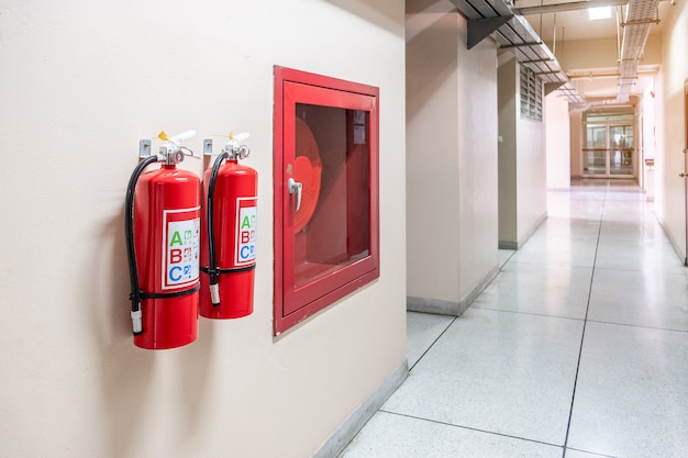 Photo fire extinguisher system on the wall background, powerful emergency equipment for industrial