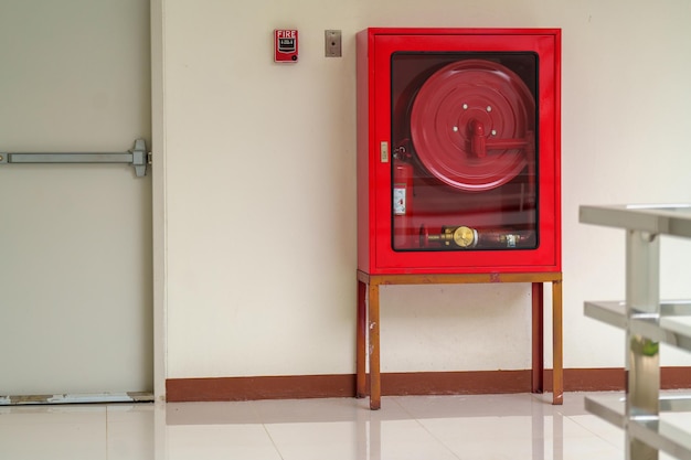 Fire extinguisher system on the wall background powerful emergency equipment for industrialxA