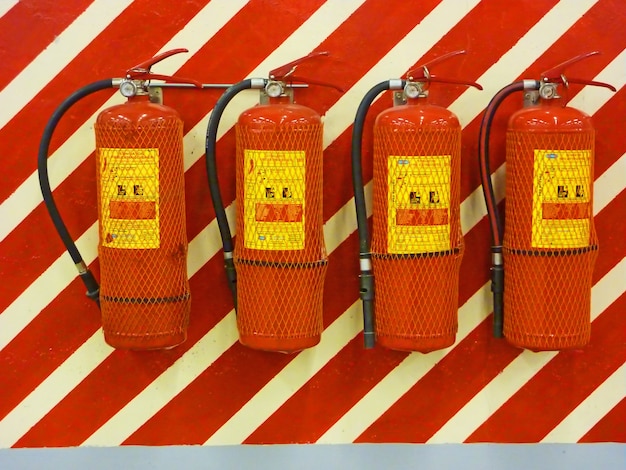 Photo fire extinguishers on a wall, ready for use