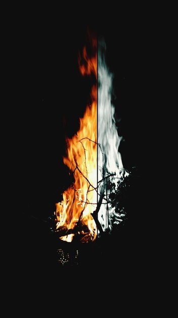 Photo fire on field at night