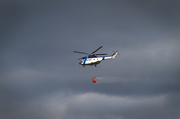 Fire fighting helicopter with bambi basket