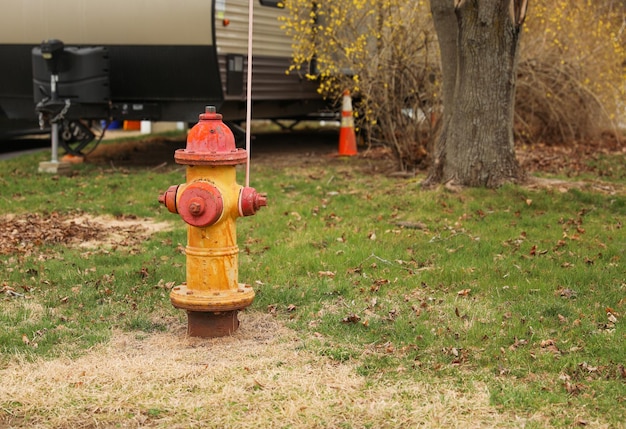 A fire hydrant is painted red and yellow.