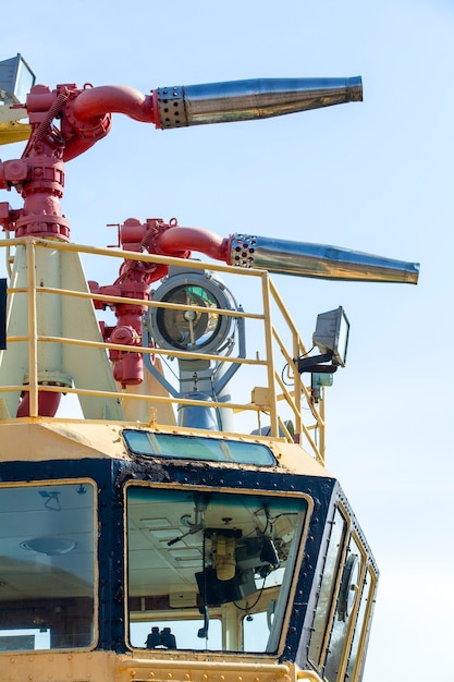 Fire hydrant on a sea-boat against the blue sky