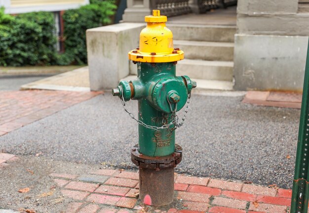 Fire hydrant stands ready a beacon of safety and preparedness amidst cityscape's hustle symbolizin