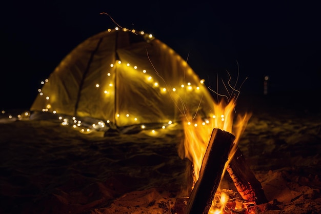 The fire at night on the beach Summer mood