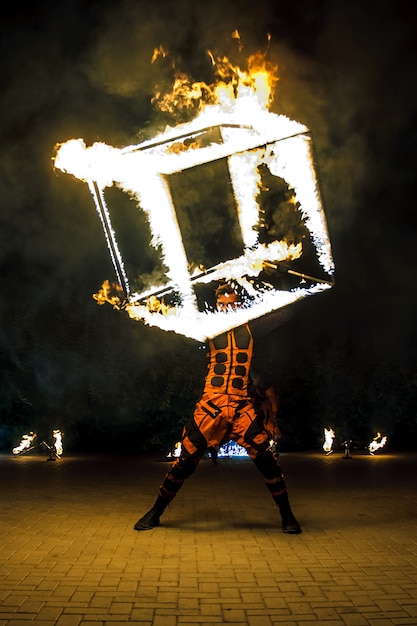 Fire show. Dancing with flame. Master with fire works.