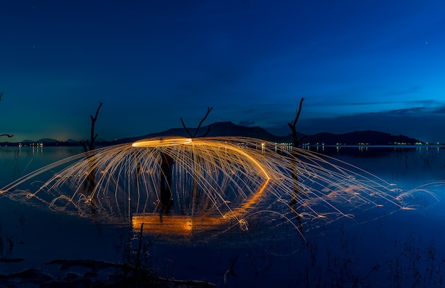 Fire spin long exposure with blue sky