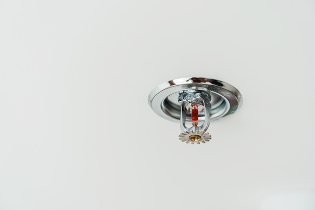 Fire Sprinkler detector mounted on roof in home or apartment Safety and conflagration security concept