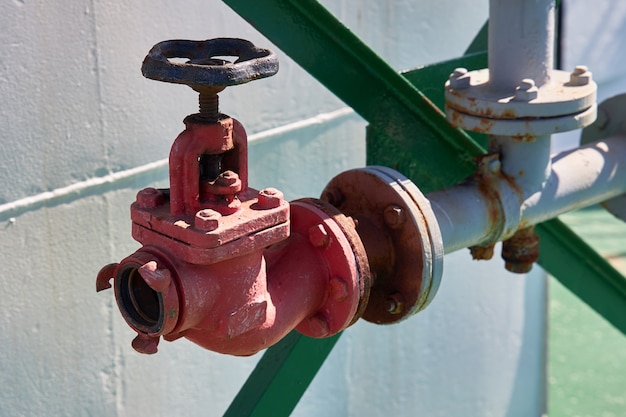 Fire valve for connecting a fire hose used to extinguish a fire on a tanker