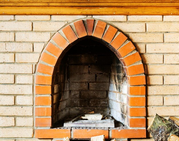 Photo firebox of not kindled brick fireplace