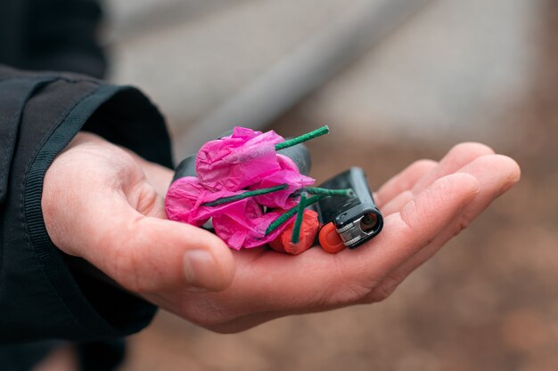 Firecrackers and lighter in a hand