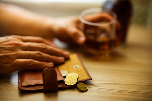 Fired man countsing his last money to drink expensive alcohol