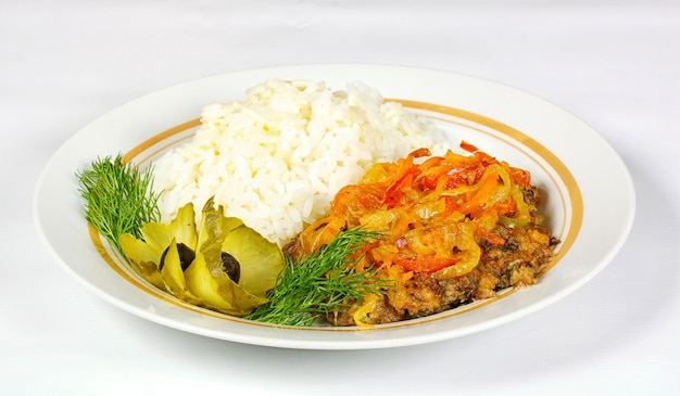 Fired meat white rice and vegetables