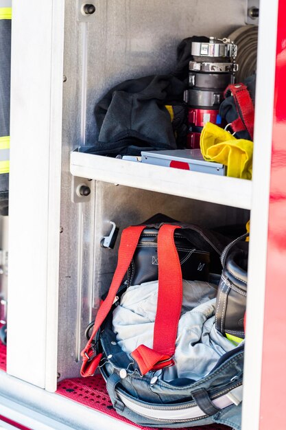 Firefighter clothing hanging on fire truck.