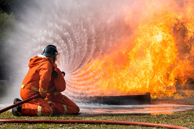 Firefighter splash water to fire hydrant