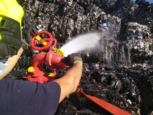 Firefighter throws water with monitor