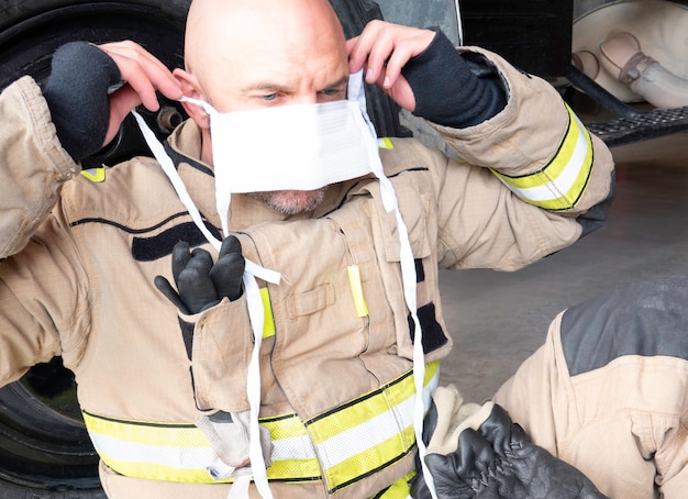 Firefighter wears a mask to protect himself