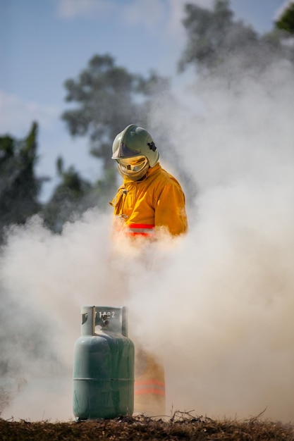 Firefighter with fire and suit for protect fire fighter for training firefighters