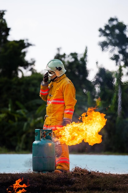 Firefighter with fire and suit for protect fire fighter for training firefighters