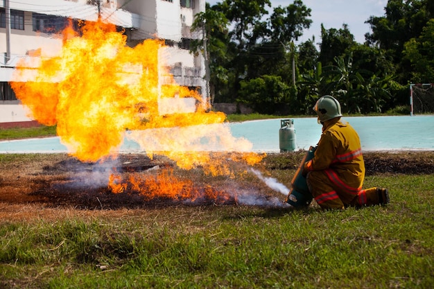 Firefighter with fire and suit for protect fire fighter for training firefighters