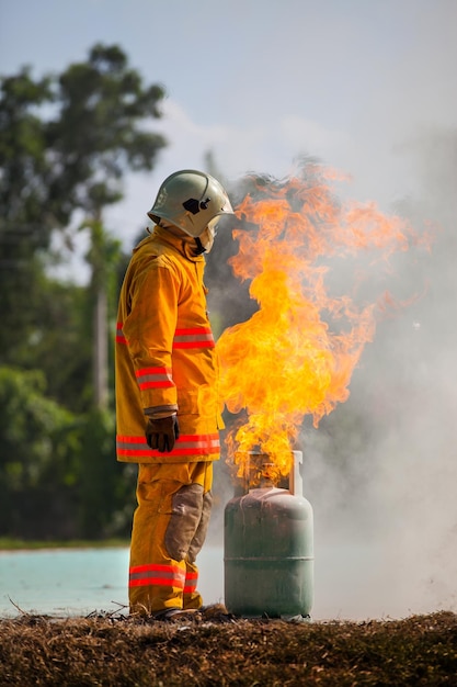 Firefighter with fire and suit for protect fire fighter for training firefighters