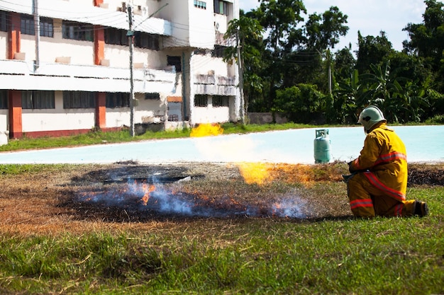 Firefighter with fire and suit for protect fire fighter for training firefighters