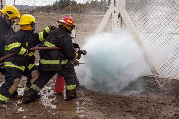 Photo firefighters are seen fighting a fire at a warehouse.