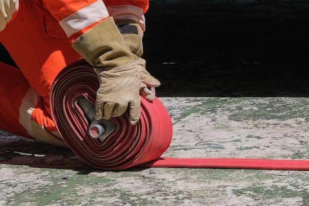 Firefighters and Fire hose coil fire and rescue training school regularly to get ready