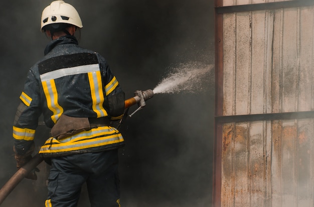 Fireman extinguishes fire