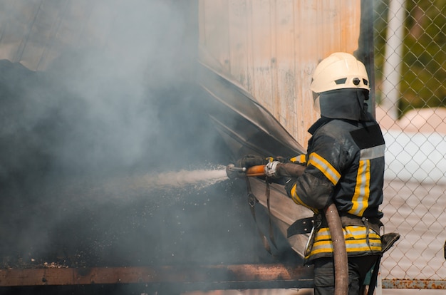 Fireman extinguishes fire