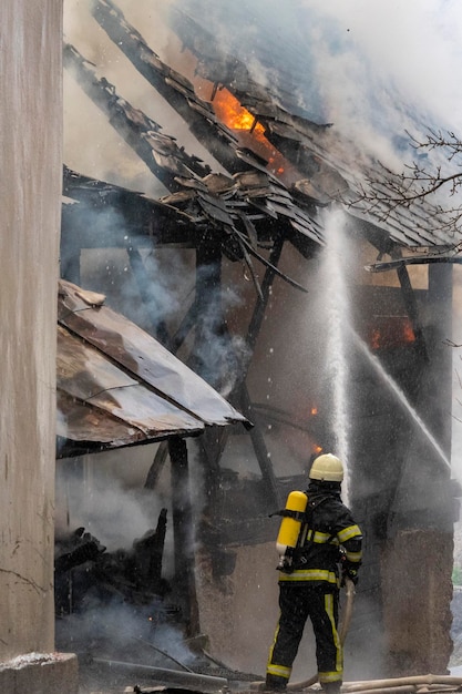 Fireman fighting a fire in house