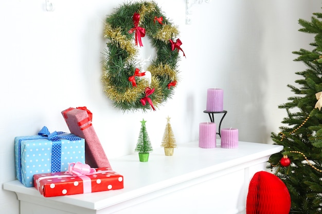 Fireplace with beautiful Christmas decorations in room