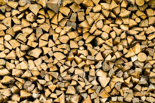 Photo firewood background in the backyard of a village house firewood masonry