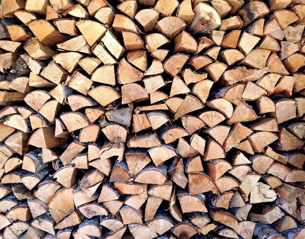 Firewood for the winter, stacks of firewood. Wooden background.