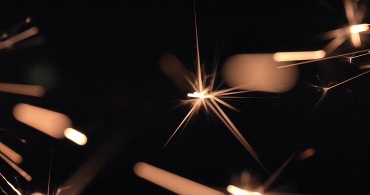 Photo firework sparks burning on black