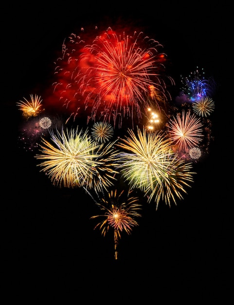 Photo fireworks abstract colorful explosions isolated on black, festiveal and celebration concept