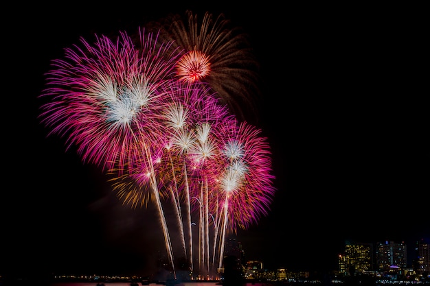 Fireworks Celebration at night sky ,Building background.