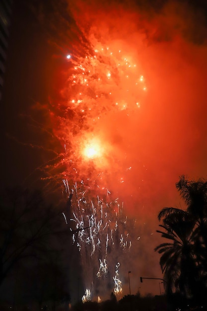 Photo fireworks of different colors and shapes exploding during valencia during the fallas celebration