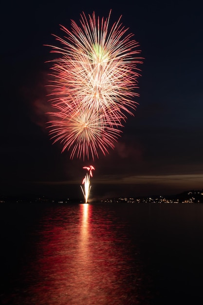 Fireworks on a lake the water reflects the light