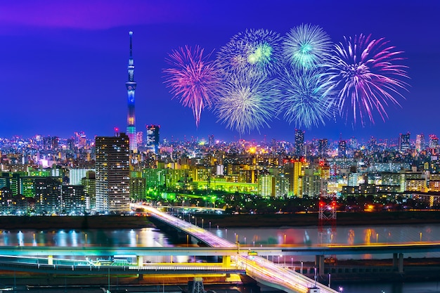 Fireworks over Tokyo cityscape at night, Japan