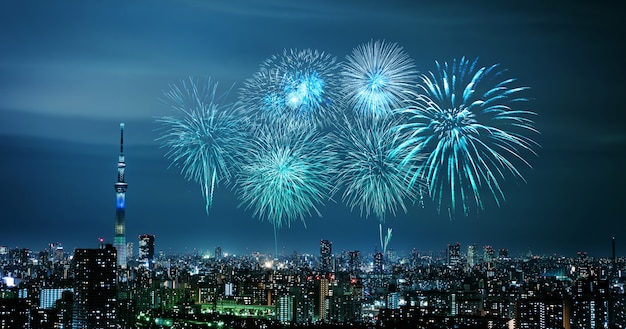 Fireworks over Tokyo cityscape at night, Japan