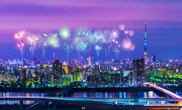 Fireworks over Tokyo cityscape at night, Japan