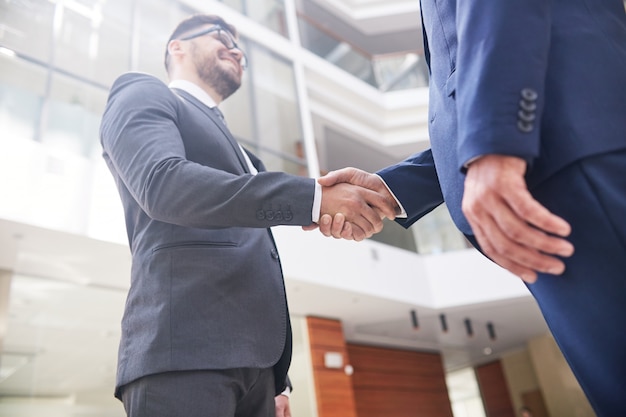 Photo firm handshake of business partners