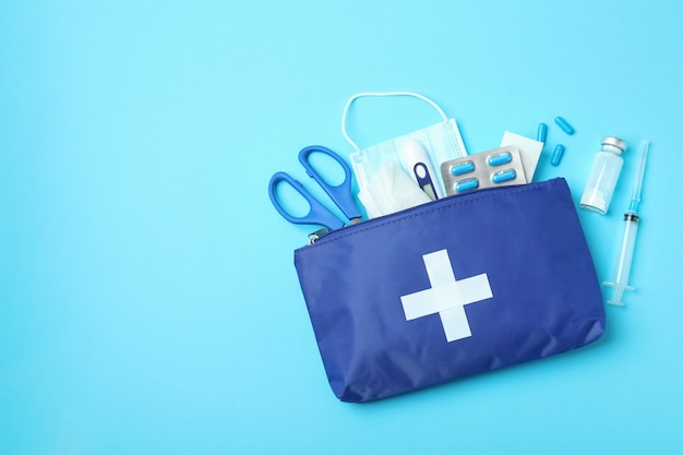 First aid medical kit on blue