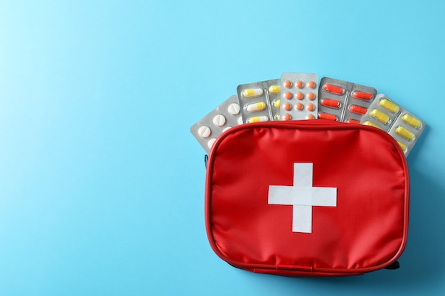 first aid medical kit on blue