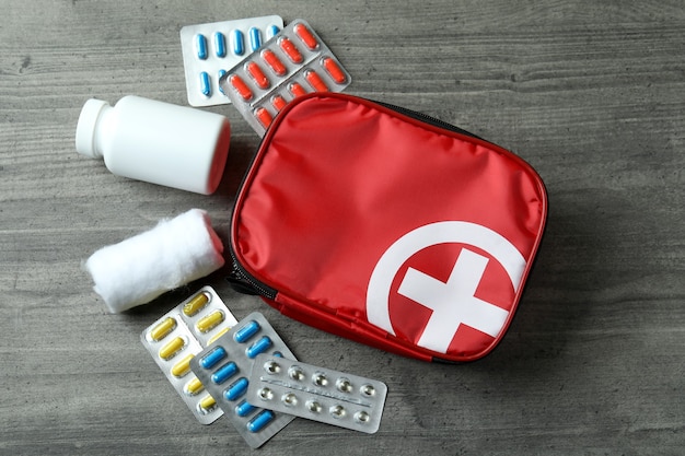 Photo first aid medical kit on gray textured table