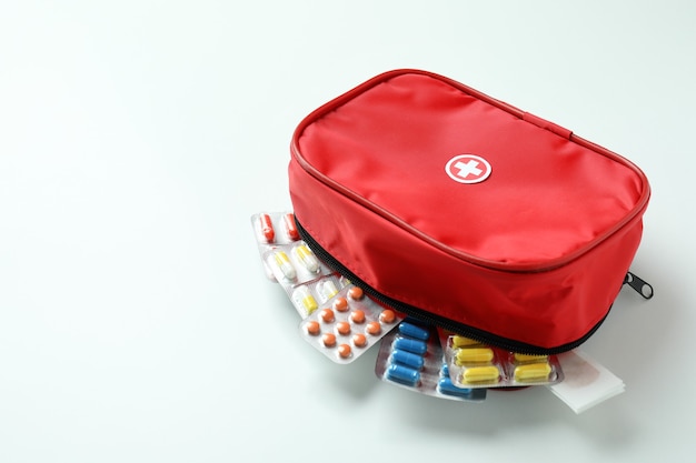 First aid medical kit on white