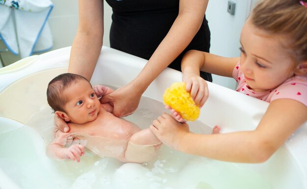 First bath of newborn baby boy