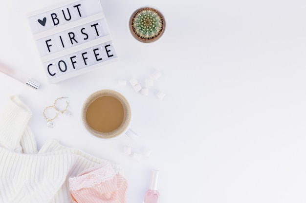 But first coffee text on lightbox with Coffee Cup and white background