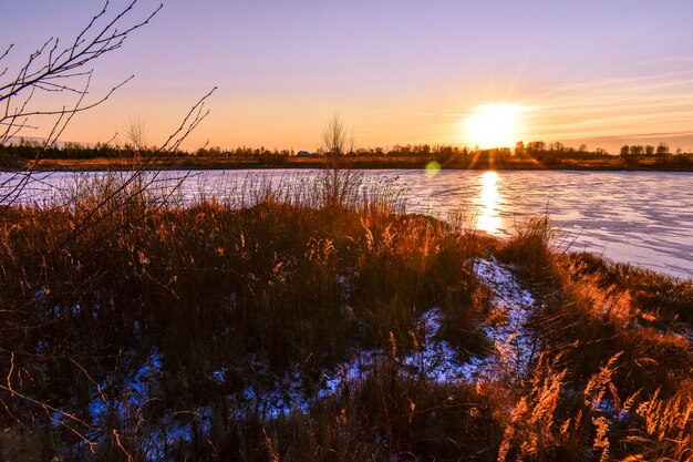 The first ice on the sun at sunset